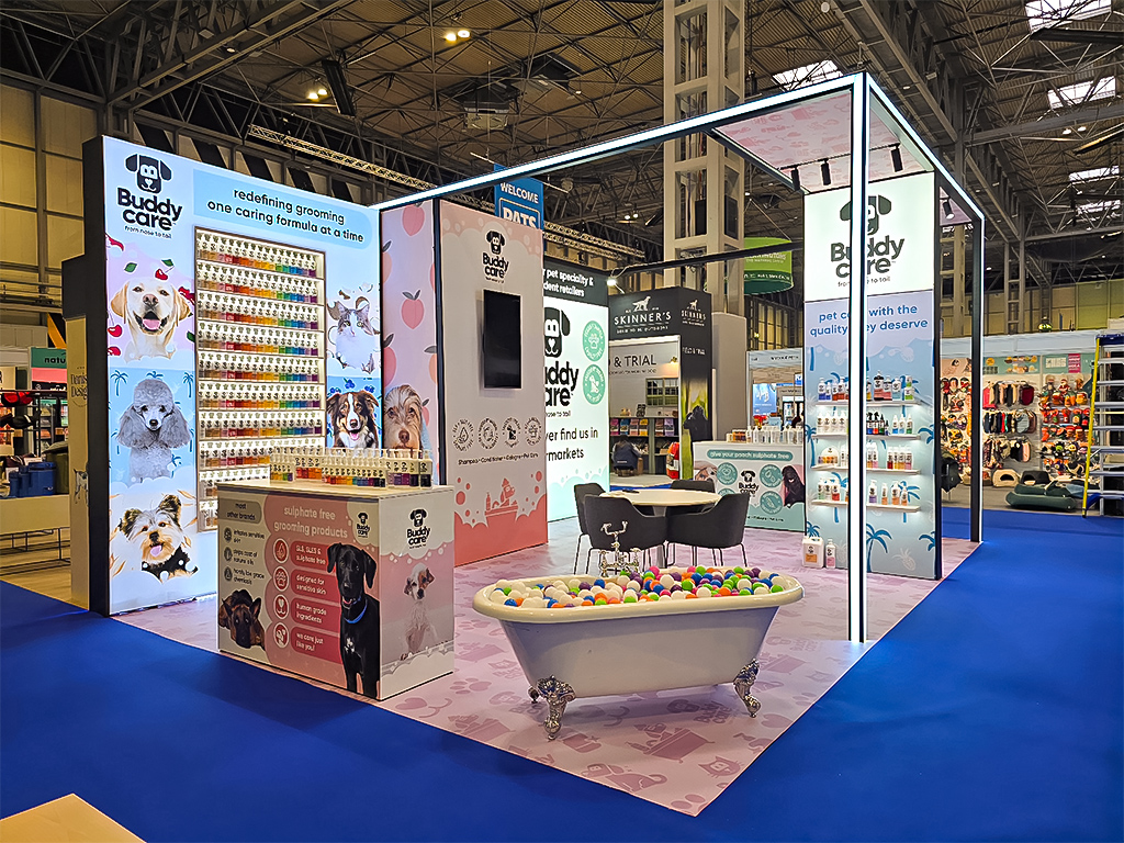Modular exhibition stand featuring recessed and floating shelving integrated within a T3 framework, illuminated with LED lighting for product display at a trade show