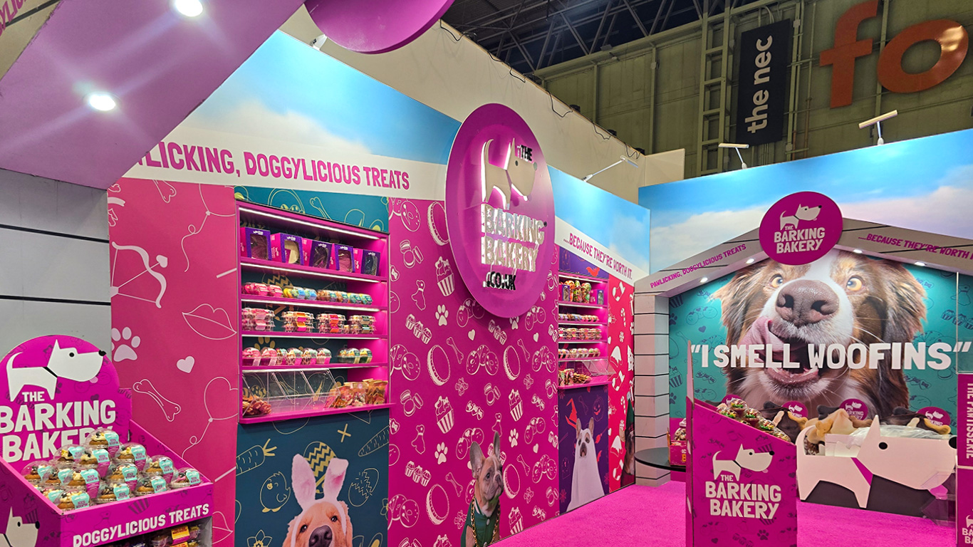 Recessed shelving display integrated within a T3 Modular Exhibition Stand for The Barking Bakery, featuring custom RAL colour-matched panels and illuminated product shelves.